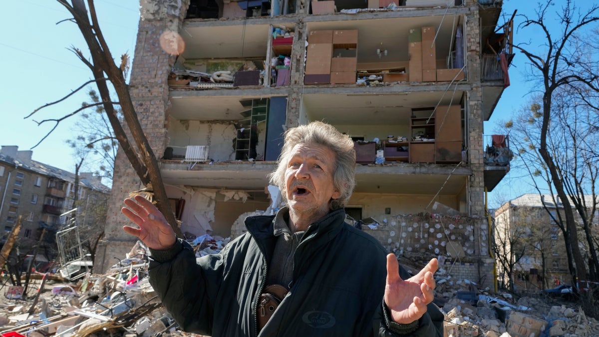 Man reacts to shelling of building