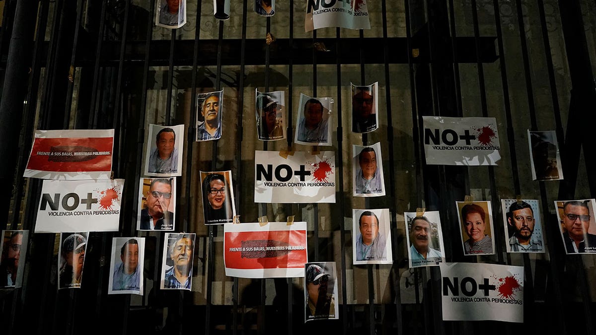 Photos of slain journalists are posted on the gate of Mexico's Attorney General's office during a vigil to protest the murder of journalist Heber Lopez, in Mexico City, Monday, Feb. 14, 2022. Lopez, who was the director of the online news site Noticias Web, was shot to death Thursday, Feb. 10, in the coastal city of Salina Cruz, in Oaxaca state. The Committee to Protect Journalists declared these six past weeks the "deadliest for the Mexican press in over a decade." (AP Photo/Eduardo Verdugo)