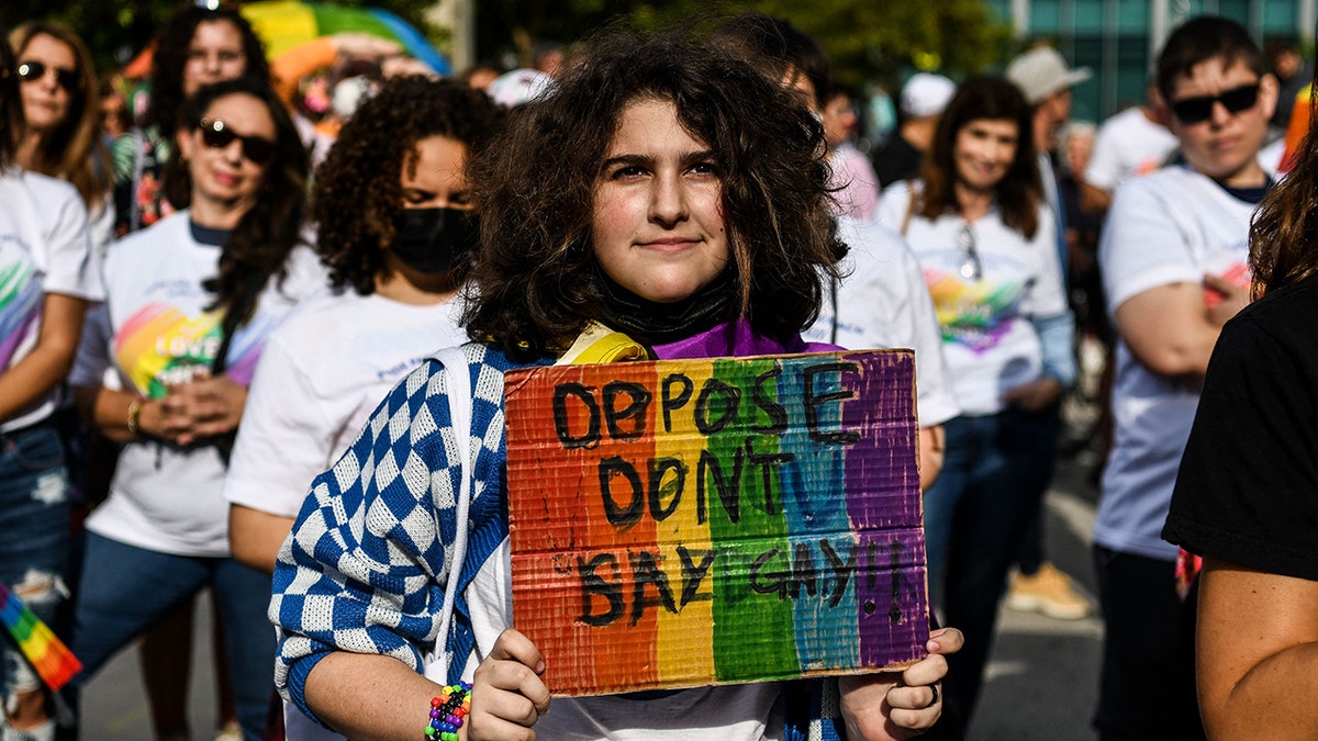 Members and supporters of the LGBTQ community attend the "Say Gay Anyway" rally in Miami Beach, Florida on March 13, 2022. - Florida's state senate on March 8 passed a controversial bill banning lessons on sexual orientation and gender identity in elementary schools, a step that critics complain will hurt the LGBTQ community. Opposition Democrats and LGBTQ rights activists have lobbied against what they call the "Don't Say Gay" law, which will affect kids in kindergarten through third grade, when they are eight or nine years old. (Photo by CHANDAN KHANNA / AFP) (Photo by CHANDAN KHANNA/AFP via Getty Images)