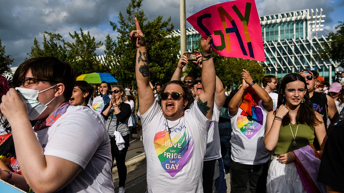 Members and supporters of the LGBTQ community attend the "Say Gay Anyway" rally in Miami Beach, Florida on March 13, 2022. (Photo by CHANDAN KHANNA / AFP) (Photo by CHANDAN KHANNA/AFP via Getty Images)