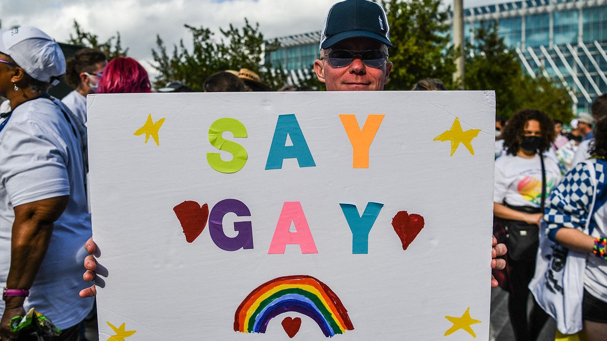 Members and supporters of the LGBTQ community attend the "Say Gay Anyway" rally in Miami Beach, Florida on March 13, 2022. 