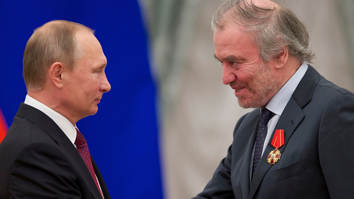 Russian President Vladimir Putin, left, presents a medal to Valery Gergiev, then the Mariinsky Theatre's artistic director, during an awards ceremony in Moscow.