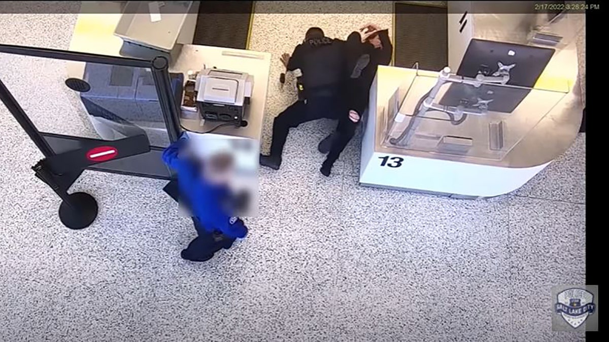 Salt Lake City police have released video showing a bystander jumping in to help an officer who was being assaulted while arresting a suspect at the city’s airport last month.