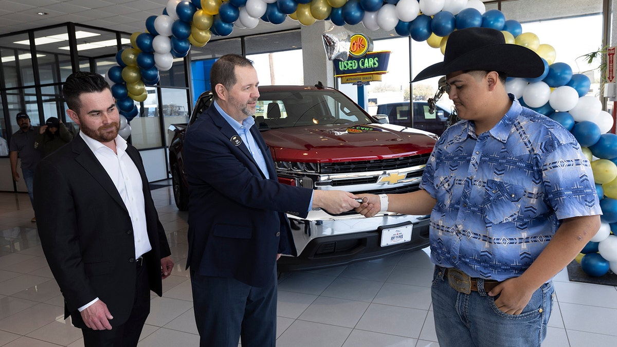Bruce Lowrie Chevrolet Vice President Randall Shapiro and Chevrolet South Central Regional Director Don Wagner Saturday presented Leon with the truck.