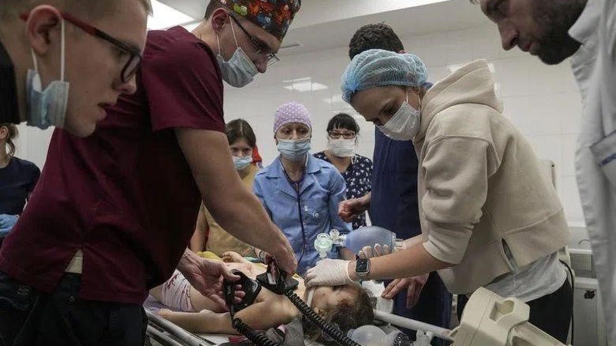 Medical staff attend to a child in Ukraine 