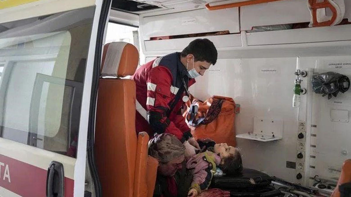 Medical staff attend to injured person in Ukraine 