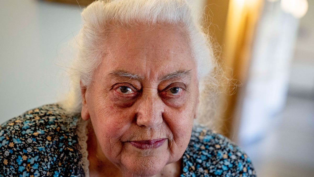 Ukrainian Holocaust survivor Galina Ulyanova looks on during an AP interview in an old people's home in Frankfurt, Germany, Sunday, March 27, 2022. As the war in Ukraine continues to get more brutal, Jewish organizations are trying to evacuate as many of the 10,000 Holocaust survivors living there as possible. 