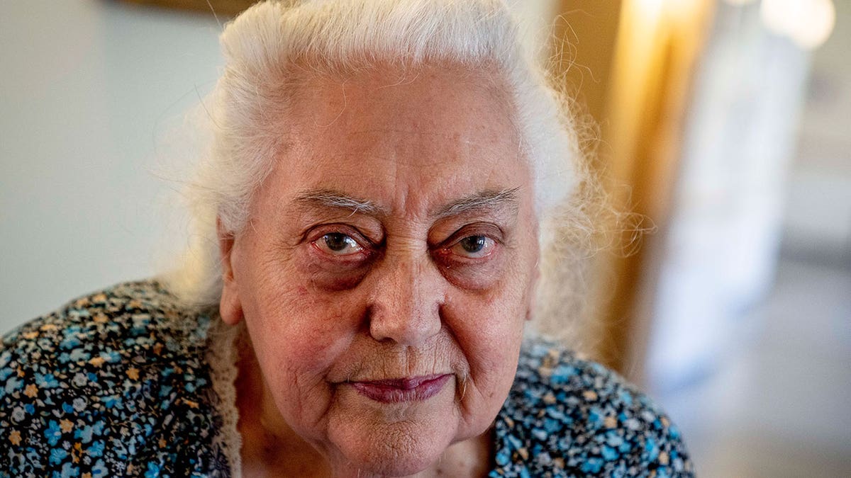 Ukrainian Holocaust survivor Galina Ulyanova looks on during an AP interview in an old people's home in Frankfurt, Germany, Sunday, March 27, 2022. As the war in Ukraine continues to get more brutal, Jewish organizations are trying to evacuate as many of the 10,000 Holocaust survivors living there as possible.?