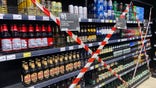Lviv, Ukraine, grocery store shelves taped off, alcohol sales banned in Russia war