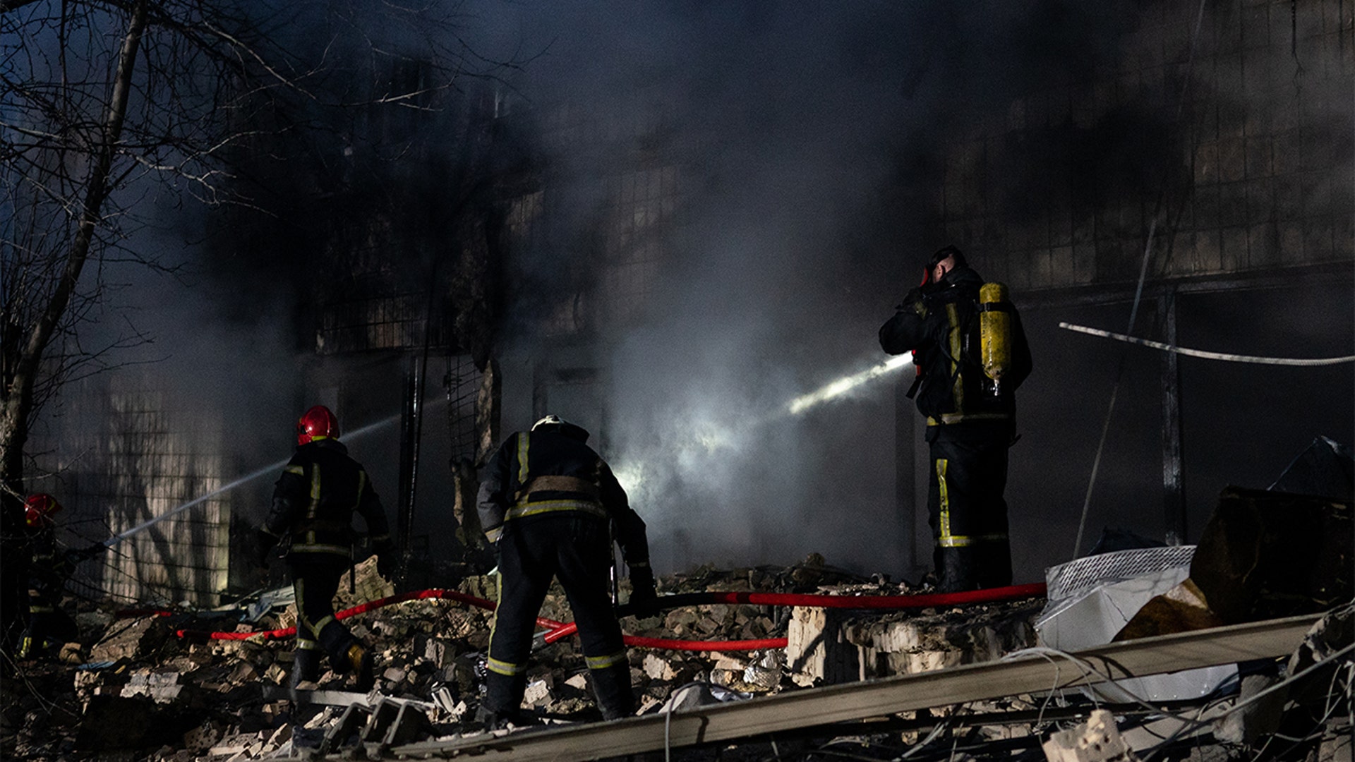 Emergency crews respond after a missile landed near Kyiv's TV Tower in Ukrainian capital, Kyiv on March 01, 2022.