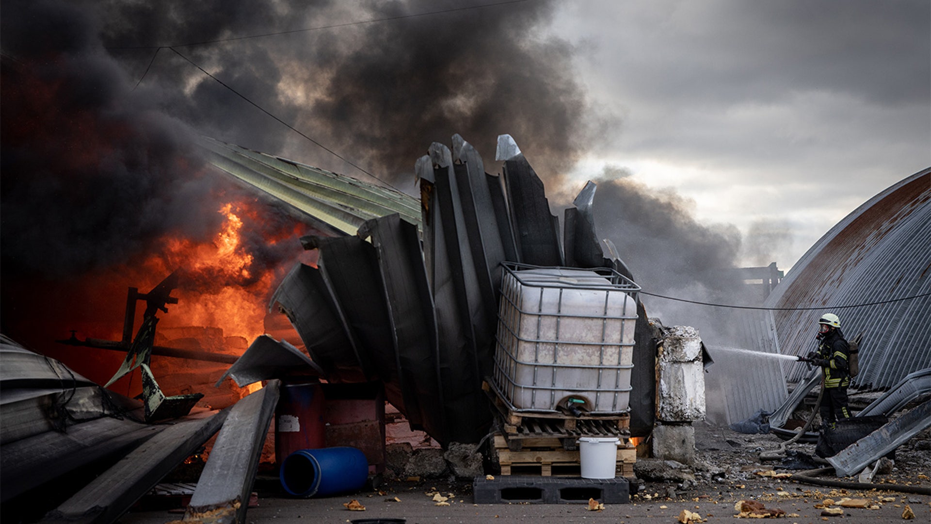 Firefighters try to extinguish a fire after a chemical warehouse was hit by Russian shelling on the eastern frontline near Kalynivka village on March 08, 2022, in Kyiv, Ukraine.