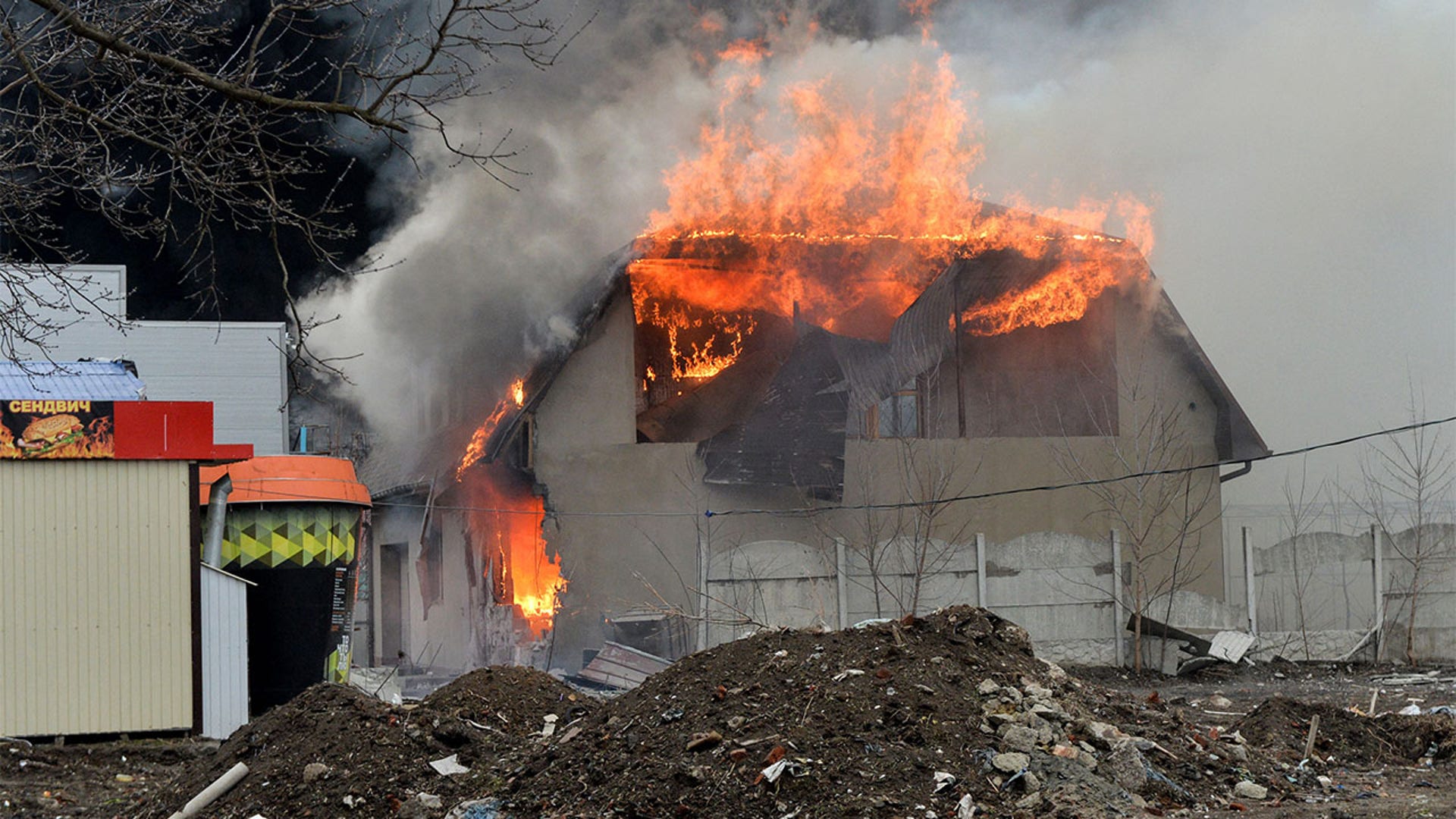 A burning building is pictured after the shelling is said by Russian forces in Ukraine's second-biggest city of Kharkiv on March 3, 2022.