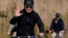 Biden goes for bike ride at the beach as Ukraine president warns of 'third world war'
