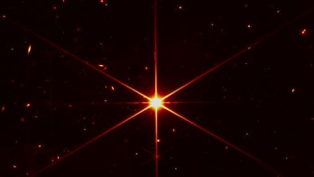 James Webb space telescope's image of star gets photobombed by galaxies