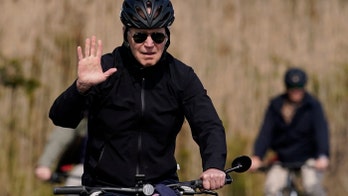 Biden goes for bike ride at the beach as Ukraine president warns of 'third world war'