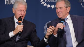 George W. Bush and Bill Clinton visit Ukrainian church to lay flowers, pay respects