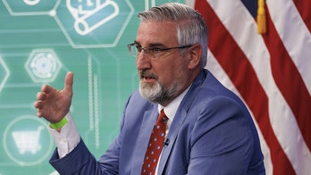 Indiana Gov. Holcomb signs elementary literacy bill into law