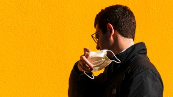 More states, cities lift mask mandates, COVID-19 restrictions as cases fall