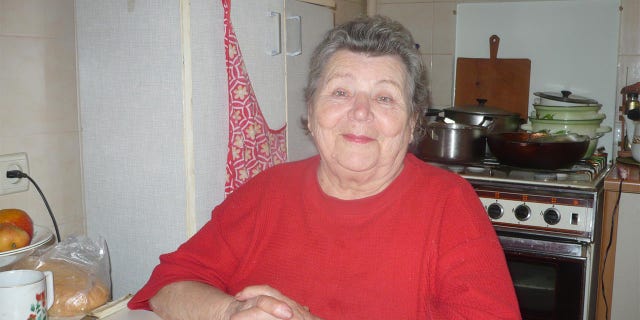 Matthew Frantsuzhan's great-grandmother, Olga, 92, sits at her table at her home in Ukraine. Matthew is an exchange student in the U.S.; he's been studying music in Iowa since last August.