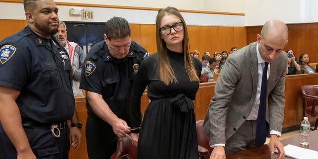 Anna Sorokin, who a New York jury convicted last month of swindling more than $200,000 from banks and people, reacts during her sentencing at Manhattan State Supreme Court New York, May 9, 2019.