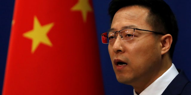 Chinese Foreign Ministry spokesman Zhao Lijian speaks at a news conference in Beijing, China April 8, 2020. Zhao on Tuesday was echoing claims from his Russian counterpart Maria Vladimirovna Zakharova, who said Kremlin troops found evidence that Ukrainians are covering up evidence of "military biological programs" in fear that the invading army will learn more.