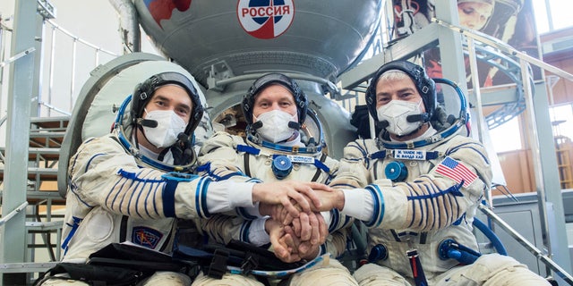 Cosmonauts Pyotr Dubrov and Oleg Novitskiy and NASA astronaut Mark Vande Hei during a training session ahead of their expedition to the International Space Station, in Star City, Russia, March 20, 2021. 