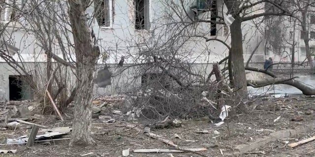 Branches litter the street next to a damaged building after ongoing hostilties from the Russian invasion of Ukraine, in Chernihiv Feb. 27, 2022 in this social media video still image obtained on Feb. 28, 2022 by Reuters.