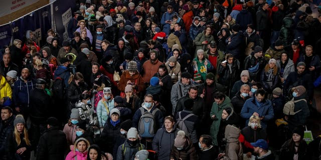 People wait to board an evacuation train from Kyiv to Lviv, at Kyiv central train station, following Russia's invasion of Ukraine, in Kyiv, Ukraine March 2, 2022. 
