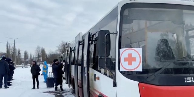 Buses wait during evacuations amid the Russian invasion of Ukraine, out of Sumy, March 8, 2022.