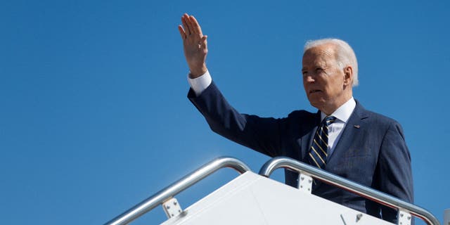 President Biden waves as he boards Air Force One for travel to Philadelphia from Joint Base Andrews, Maryland, March 11, 2022. 