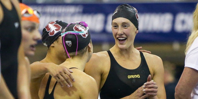 Stanford Cardinal swimmer Taylor Ruck celebrates with teammates after winning the 800 free relay national championship at the NCAA women's swimming and diving championships at Georgia Tech. 