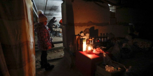 Local residents stay at a bomb shelter during Ukraine-Russia conflict in the besieged southern port city of Mariupol, Ukraine March 20, 2022. (REUTERS/Alexander Ermochenko)