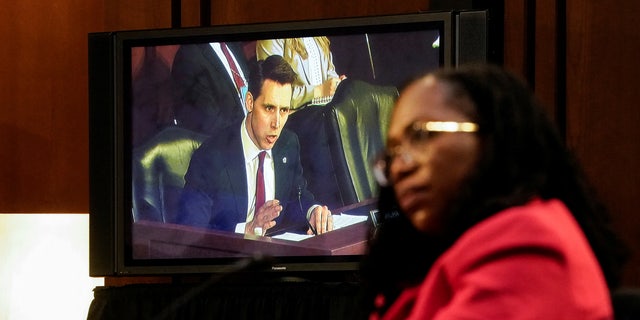 Judge Ketanji Brown Jackson listens to questions from Sen. Josh Hawley, R-Mo., seen on video display, as she testifies during a Senate Judiciary Committee confirmation hearing on Capitol Hill on March 22, 2022.