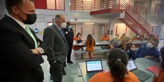 Sheriff Chris Swanson and Rep. Dan Kildee, D-Mich., visit inmates in prison.