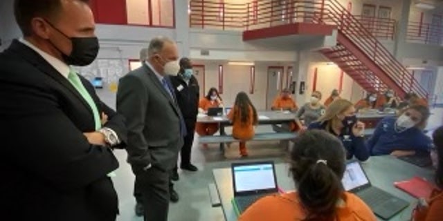 Sheriff Chris Swanson and Rep. Dan Kildee, D-Mich., visit inmates in prison. 