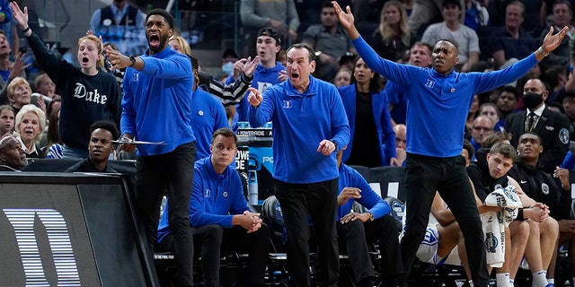 Duke head coach Mike Krzyzewski, middle, and assistant coaches react during the first half of a college basketball game between Duke and Texas Tech in the Sweet 16 round of the NCAA tournament in San Francisco, Thursday, March 24, 2022. (AP Photo/Marcio Jose Sanchez)