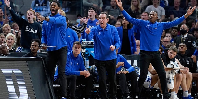 Duke head coach Mike Krzyzewski, middle, and assistant coaches react during the first half of a college basketball game between Duke and Texas Tech in the Sweet 16 round of the NCAA tournament in San Francisco, Thursday, March 24, 2022. (AP Photo/Marcio Jose Sanchez)