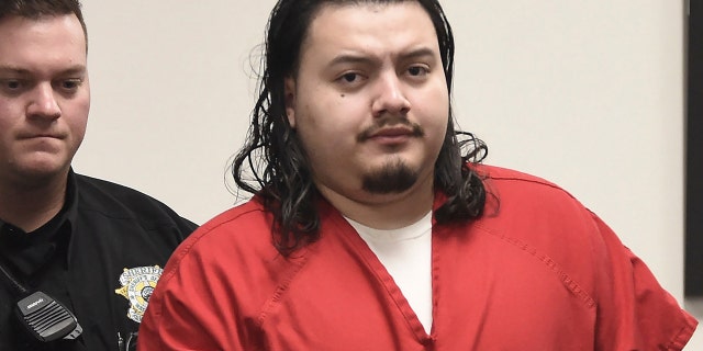 Wilber Ernesto Martinez Guzman enters the courtroom in Washoe County District Court in Reno on Monday, Feb. 28, 2022.