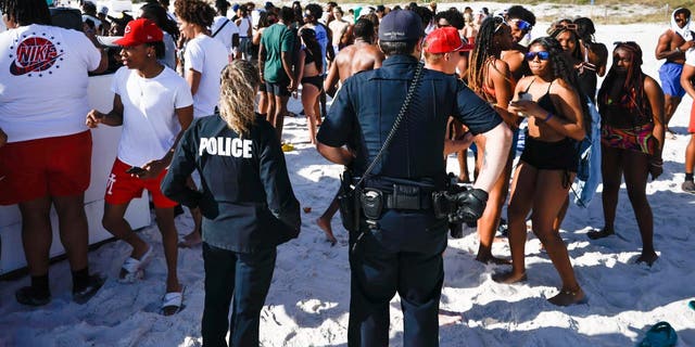 Police break up spring break crowd at Panama City Beach.