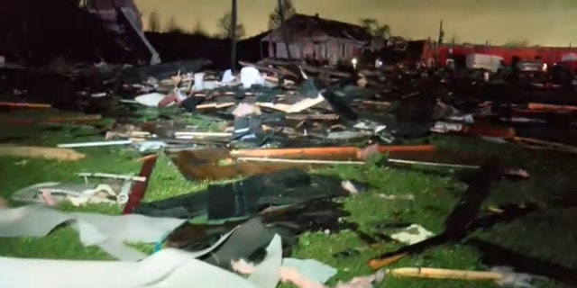 Pieces of a destroyed home are scattered in a yard after a tornado struck Arabi, Louisiana on Tuesday, March 22, 2022.