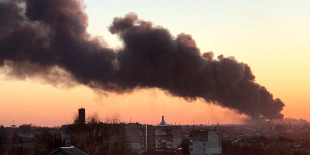 A cloud of smoke raises after an explosion in Lviv, western Ukraine, Friday, March 18, 2022.