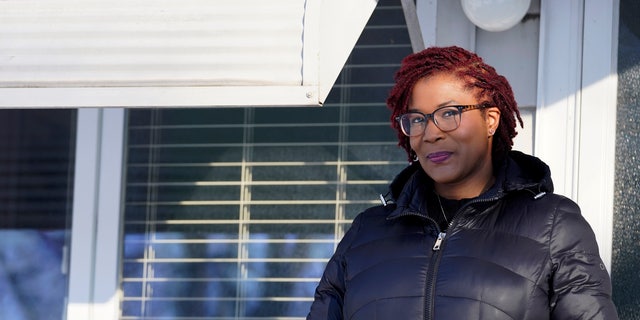 Sameerah Miller poses for a photo at her home in Lansing, Ill.