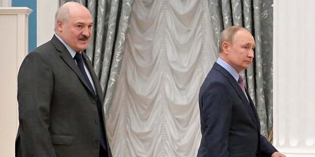 Russian President Vladimir Putin, right, and Belarusian President Alexander Lukashenko leave a joint news conference following their talks in the Kremlin in Moscow, Russia, Friday, Feb.  18, 2022.