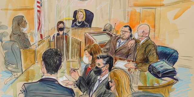 This artist sketch depicts Judge Dabney Friedrich looking out from the bench during jury selection for Guy Wesley Reffitt, joined by his lawyer William Welch, top right, in Federal Court, in Washington, Monday, Feb. 28, 2022.