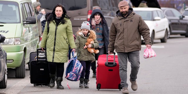 Refugees from Ukraine arrive at the border crossing Vysne Nemecke, Slovakia, Tuesday, March 1, 2022.