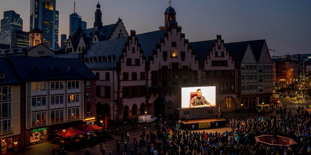 The image of Ukrainian President Volodymyr Zelenskyy is seen on a video screen at a pro-Ukraine rally in Romerberg Square in Frankfurt, Germany, March 4, 2022.