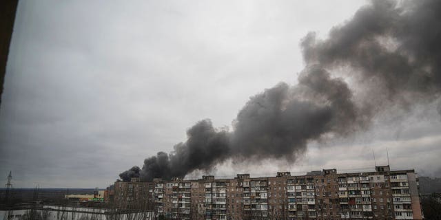 Smoke rise after shelling by Russian forces in Mariupol, Ukraine, Friday, March 4, 2022.(AP Photo/Evgeniy Maloletka)