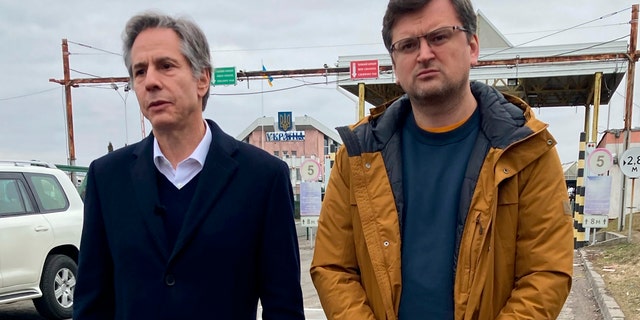 U.S. Secretary of State Antony Blinken speaks with Ukrainian Foreign Minister Dmytro Kuleba at Korczowa border crossing in Poland on Saturday, March 5, 2022. (AP Photo/Matthew Lee).