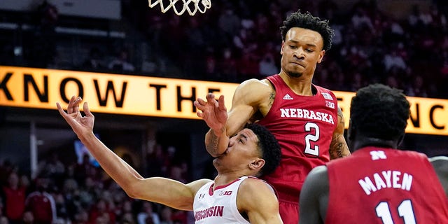 Nebraska's Trey McGowens (2) fouls Wisconsin's Johnny Davis (1) during the second half of an NCAA college basketball game, Sunday, March 6, 2022, in Madison, Wis. McGowens was charged with a flagrant foul on the play. Nebraska won 74-73.