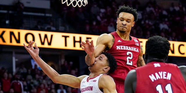 Nebraska's Trey McGowens (2) fouls Wisconsin's Johnny Davis (1) during the second half of an NCAA college basketball game, Sunday, March 6, 2022, in Madison, Wis. McGowens was charged with a flagrant foul on the play. Nebraska won 74-73.